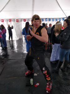 Johnny Lawrence, in full Cobra Kai gi, crushes 80s Day with Pants and Fizz